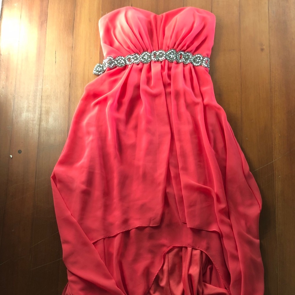 Strapless coral high-low dress w/ rhinestone belt.